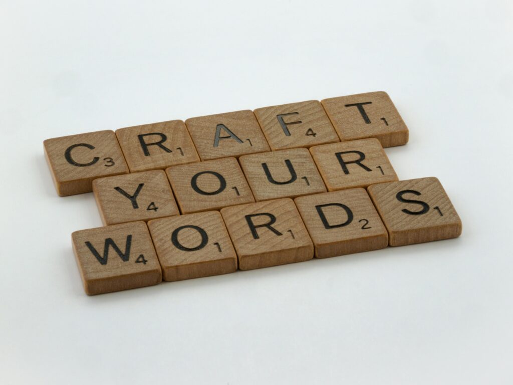 Creative arrangement of word tiles spelling 'Craft Your Words' on a white background.